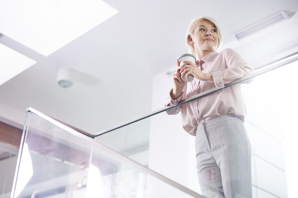 businesswoman drinking coffee while a short break